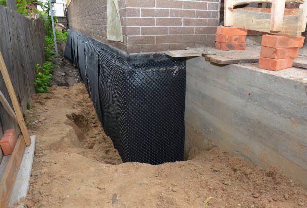 SJ Waterproofing Pros technician performing targeted Vapor Barrier Installation assessment in Oregon, OH